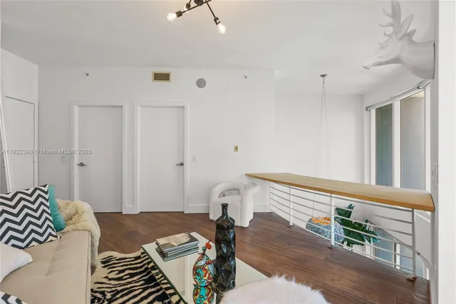 a view of a patio with a table and chairs