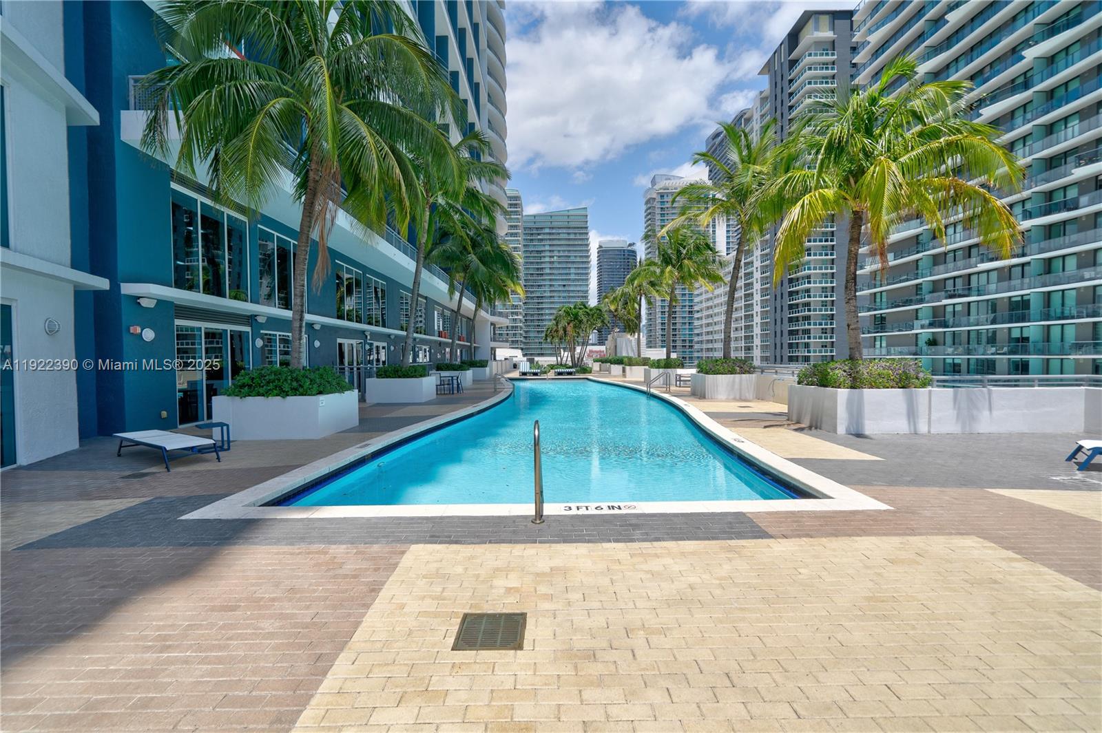60 Southwest 13th Street, Unit 4616 Miami, FL 33130 - Photo 35 of 55 a view of a swimming pool with a patio