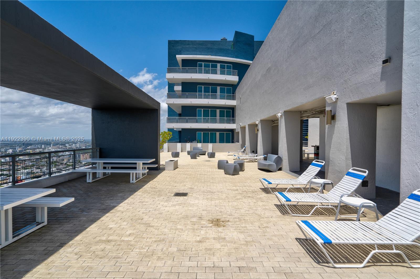 60 Southwest 13th Street, Unit 4616 Miami, FL 33130 - Photo 40 of 55 a view of a workspace with furniture and floor to ceiling window