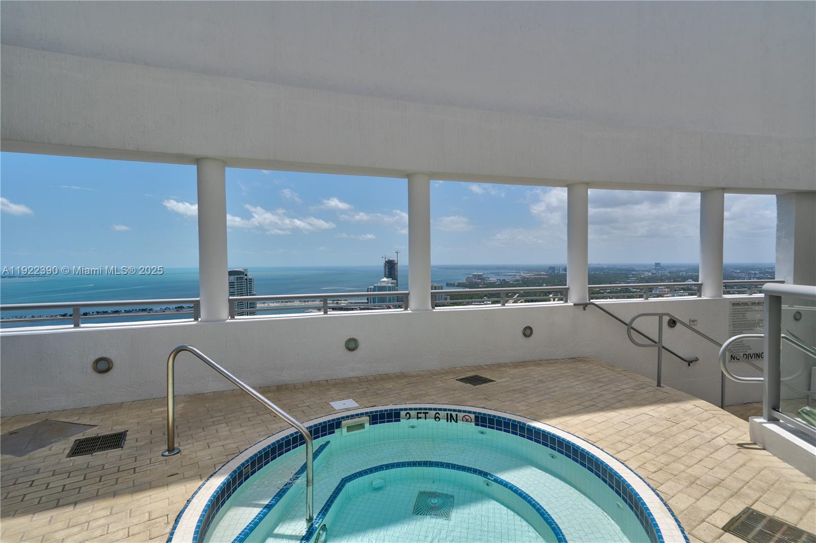 60 Southwest 13th Street, Unit 4616 Miami, FL 33130 - Photo 45 of 55 a living room with a floor to ceiling window and a table