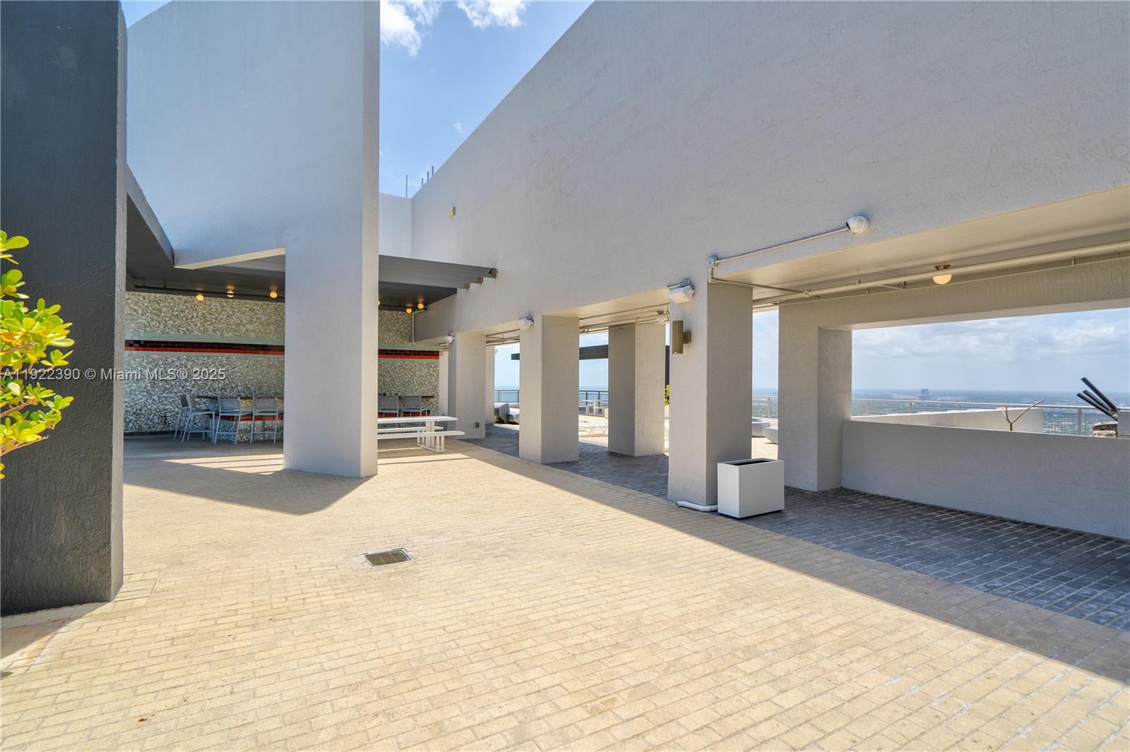 60 Southwest 13th Street, Unit 4616 Miami, FL 33130 - Photo 52 of 55 a view of an empty room with wooden floor and a window