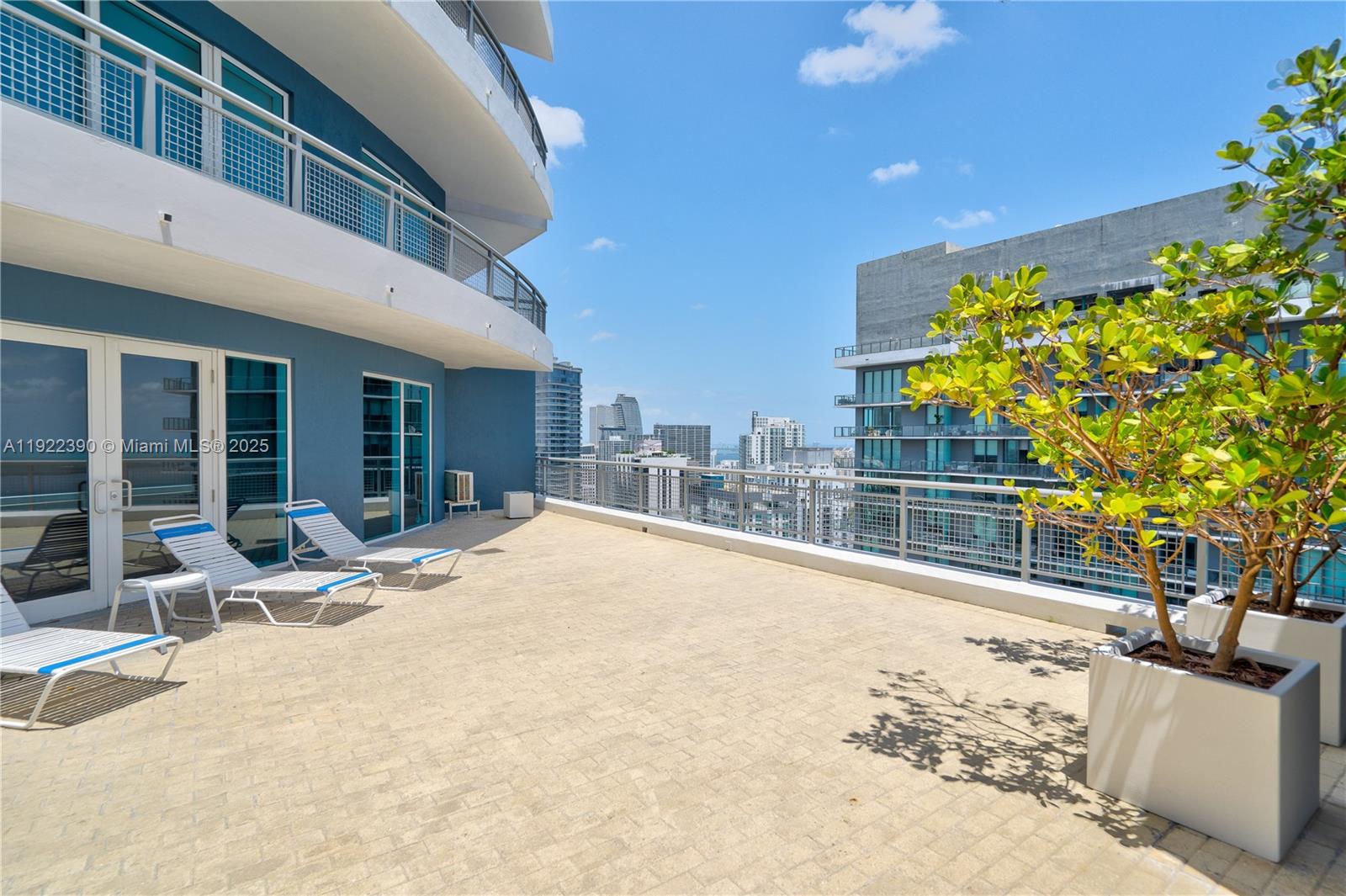 60 Southwest 13th Street, Unit 4616 Miami, FL 33130 - Photo 53 of 55 a swimming pool with outdoor seating and yard