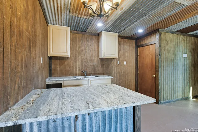 a kitchen with a stove and a refrigerator