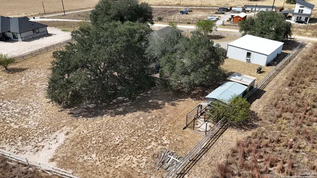an aerial view of residential house with outdoor space