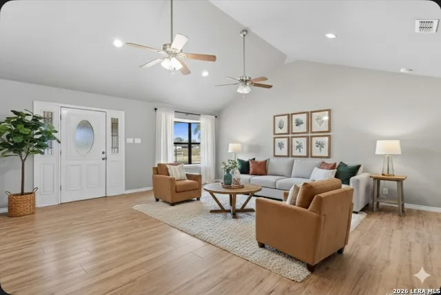 a living room with furniture and a large window