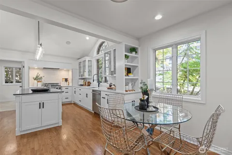 a kitchen with counter top space a sink cabinets and appliances