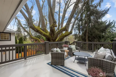 a view of a chairs and tables in the balcony