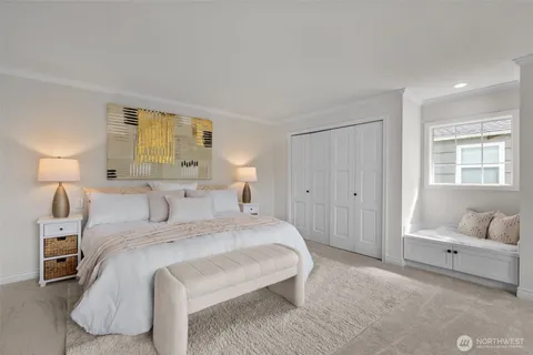 a bedroom with a bed and a couch