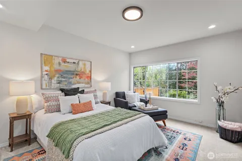 a bedroom with bed and a window