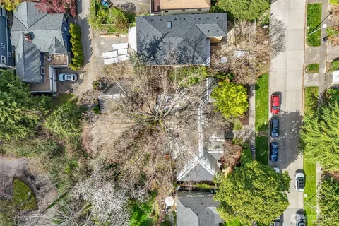 an aerial view of houses with yard