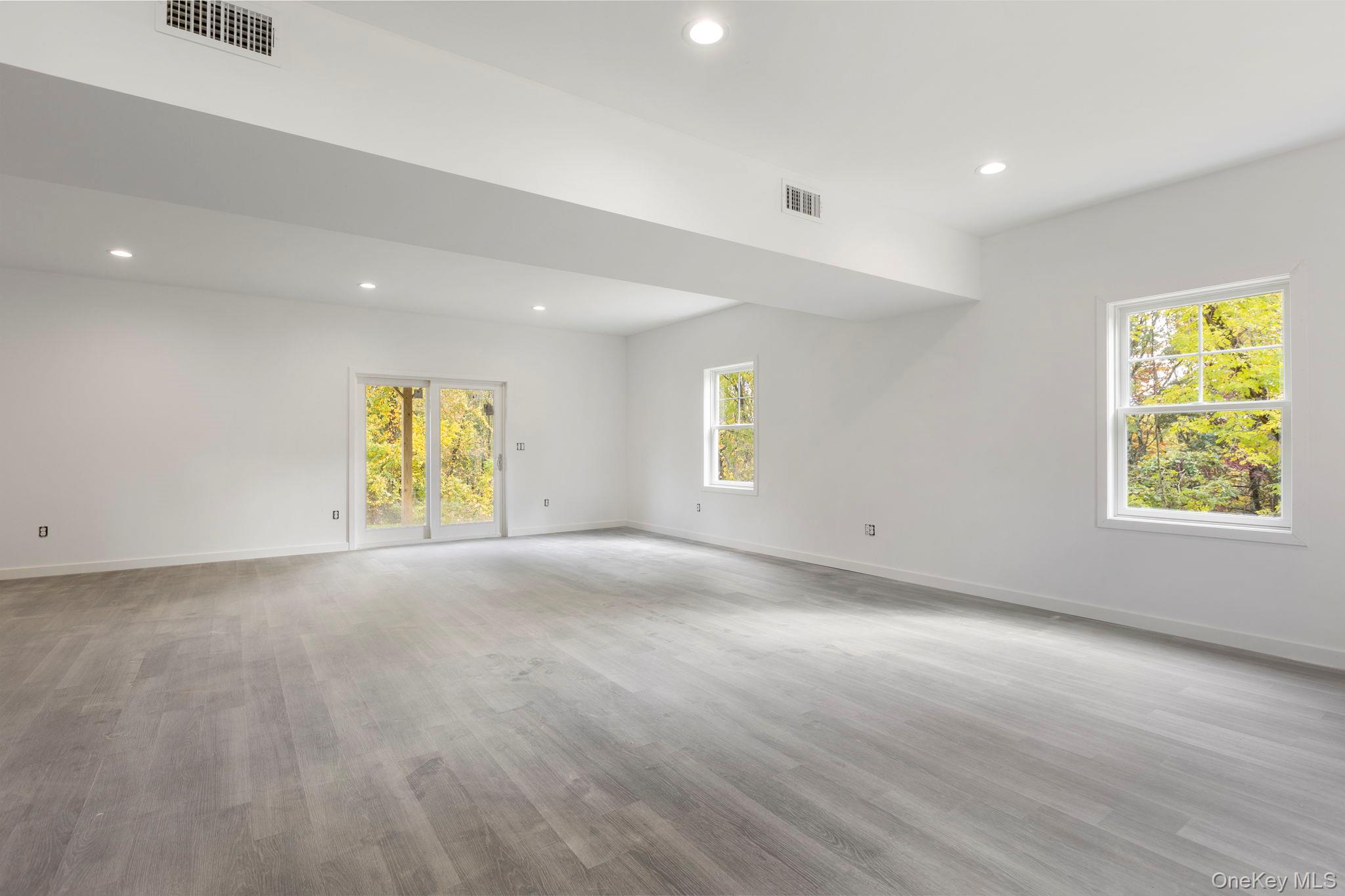 73 Farm To Market Road Brewster, NY 10509 - Photo 14 of 23 Lower level when built will offer laminate flooring and walk out to yard-Picture depicts previously built similar home.Subject to change