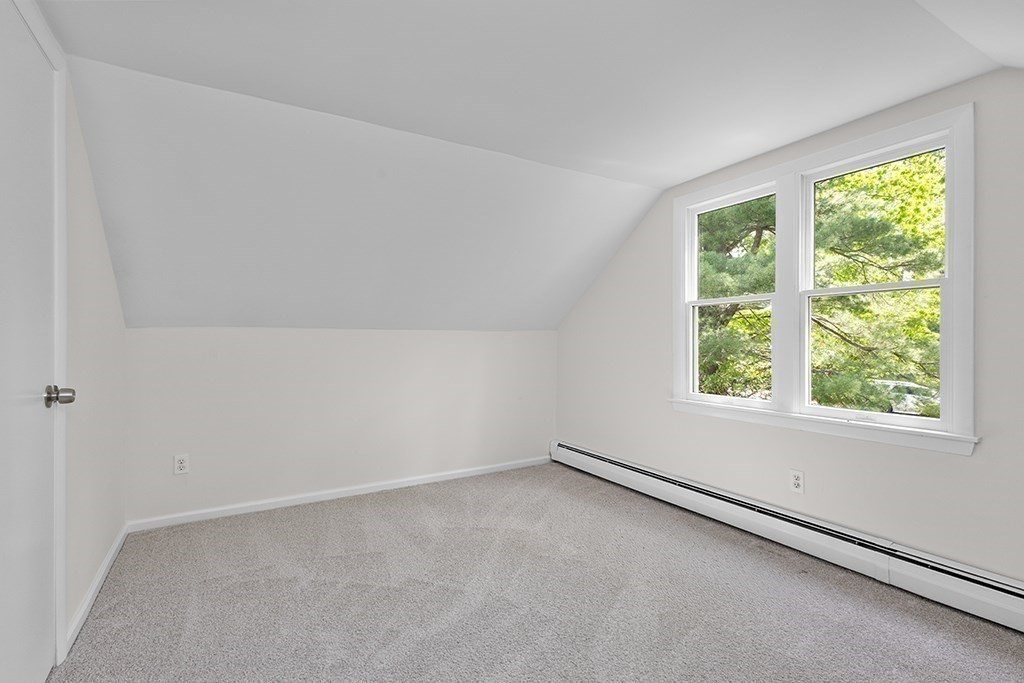 117 Oak Ridge Drive Ayer, MA 01432 - Photo 17 of 26 an empty room with a window
