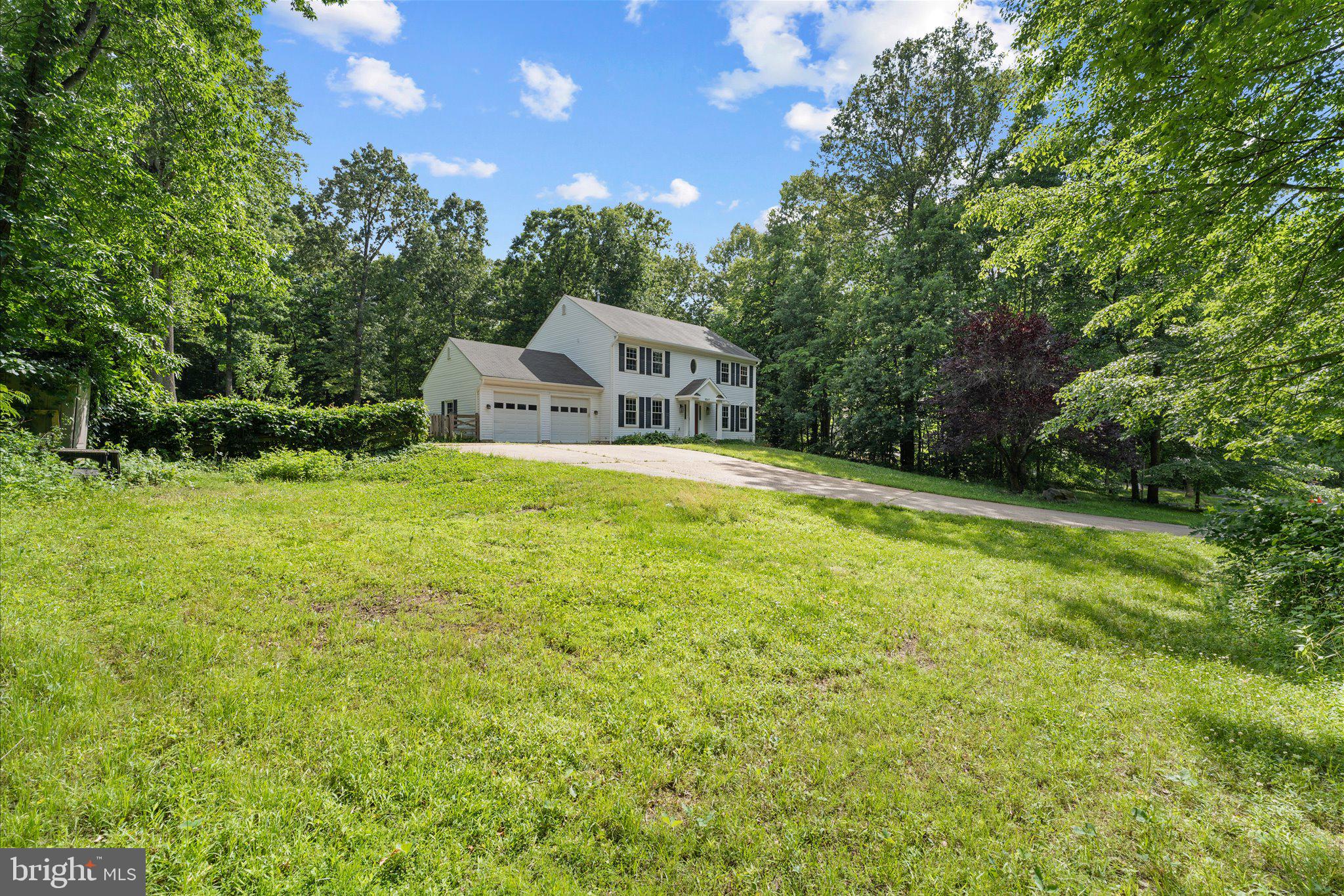 8047 Counselor Road Manassas, VA 20112 - Photo 2 of 55 Expansive backyard surrounded by mature trees and