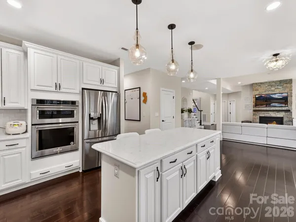 a large kitchen with cabinets and stainless steel appliances