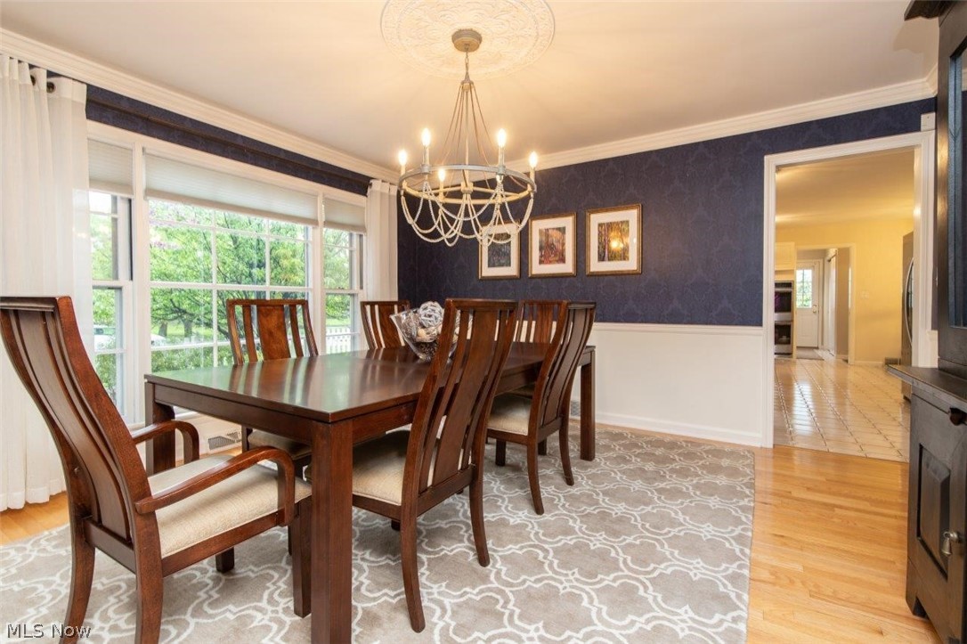 Elegant Formal Dining Room with Hardwood Floors and Crown and Chair Rail Moldings
