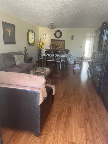 a kitchen with stainless steel appliances wooden cabinets sink and stove
