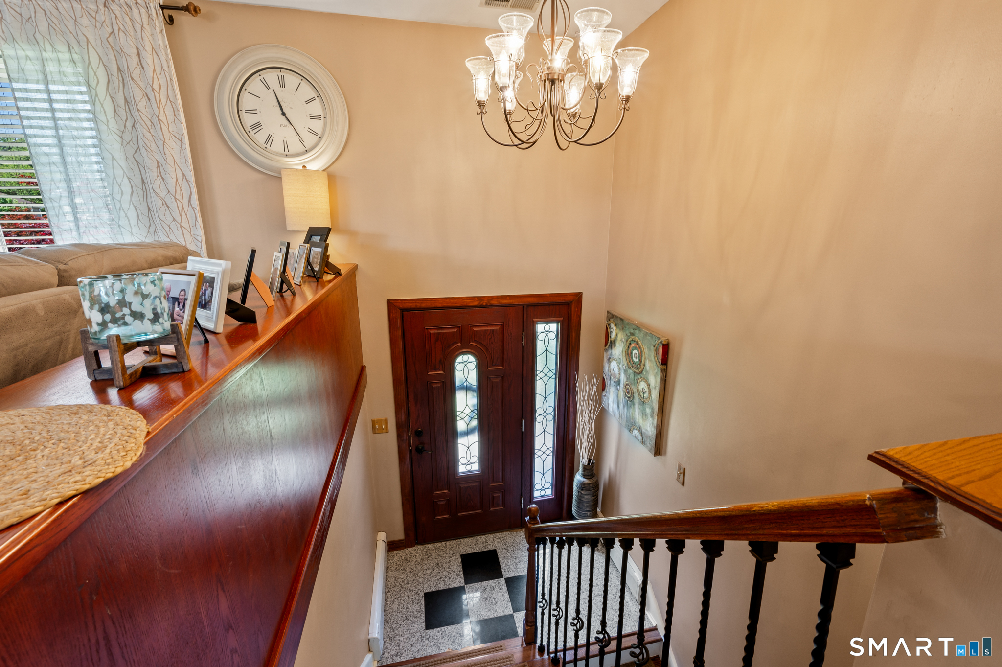 201 Ridge Crest Circle Wethersfield, CT 06109 - Photo 11 of 35 a view of a hallway with entryway wooden floor and front door