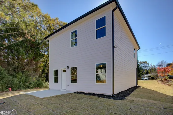 a front view of a house with yard