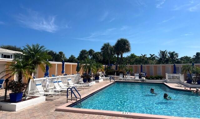 6800 Northeast 22nd Way, Unit 2132 Fort Lauderdale, FL 33308 - Photo 21 of 26 a view of swimming pool with outdoor seating and plants