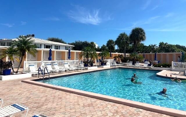 6800 Northeast 22nd Way, Unit 2132 Fort Lauderdale, FL 33308 - Photo 22 of 26 a view of swimming pool with outdoor seating and plants