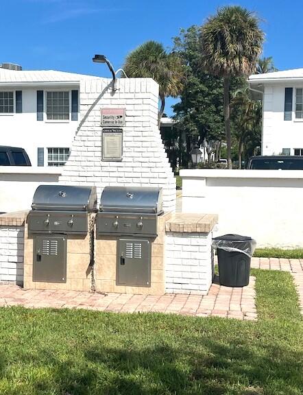 6800 Northeast 22nd Way, Unit 2132 Fort Lauderdale, FL 33308 - Photo 25 of 26 a front view of a house with a yard