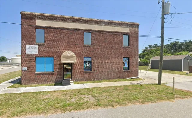 a view of a backyard of the house