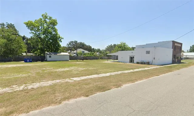 a view of a swimming pool with an outdoor space and seating area