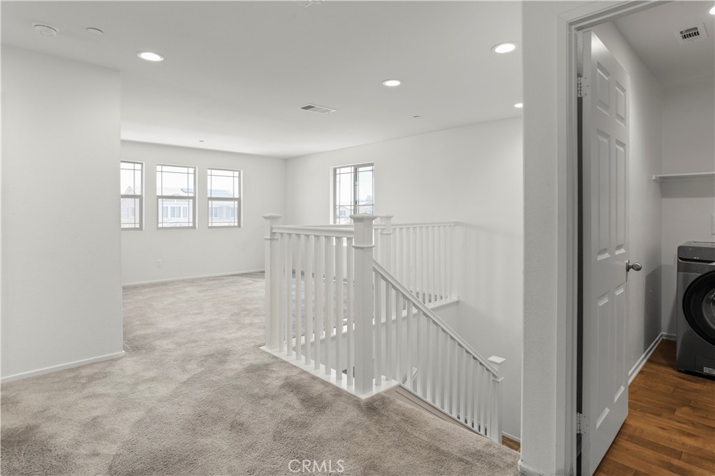 3320 Jack Rabbit Court Perris, CA 92570 - Photo 20 of 42 a view of a hallway with a window and stairs