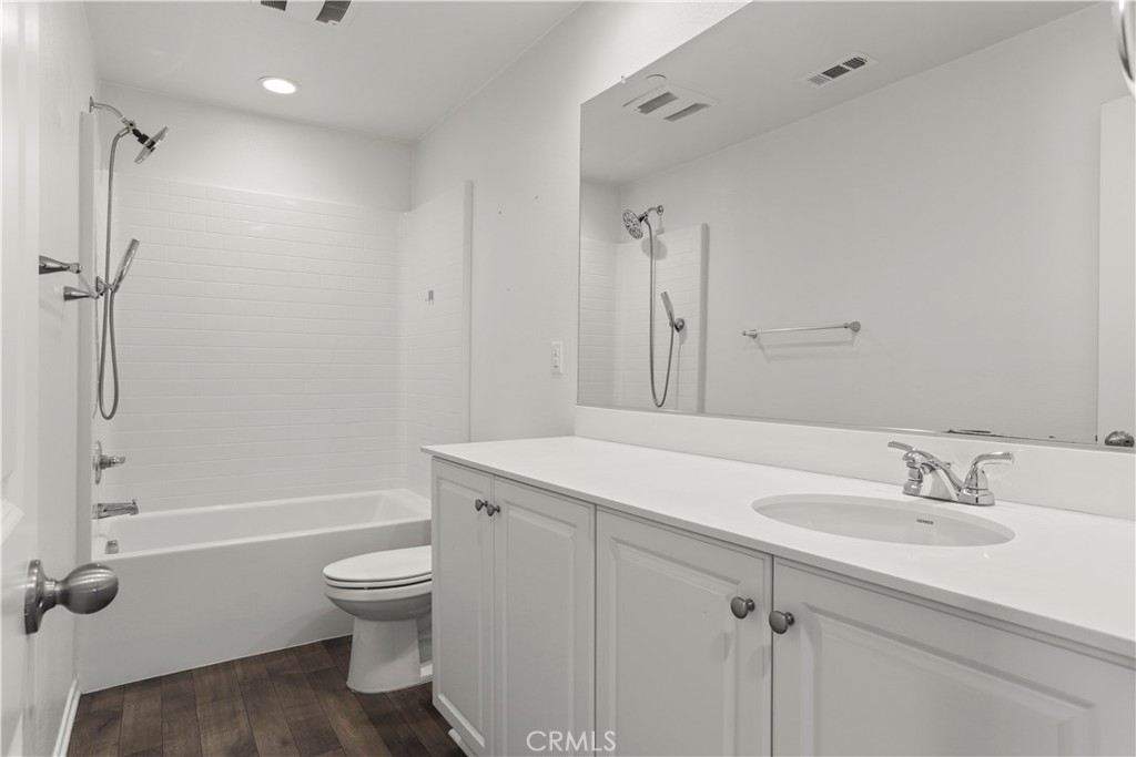 3320 Jack Rabbit Court Perris, CA 92570 - Photo 26 of 42 a bathroom with a sink a toilet and shower