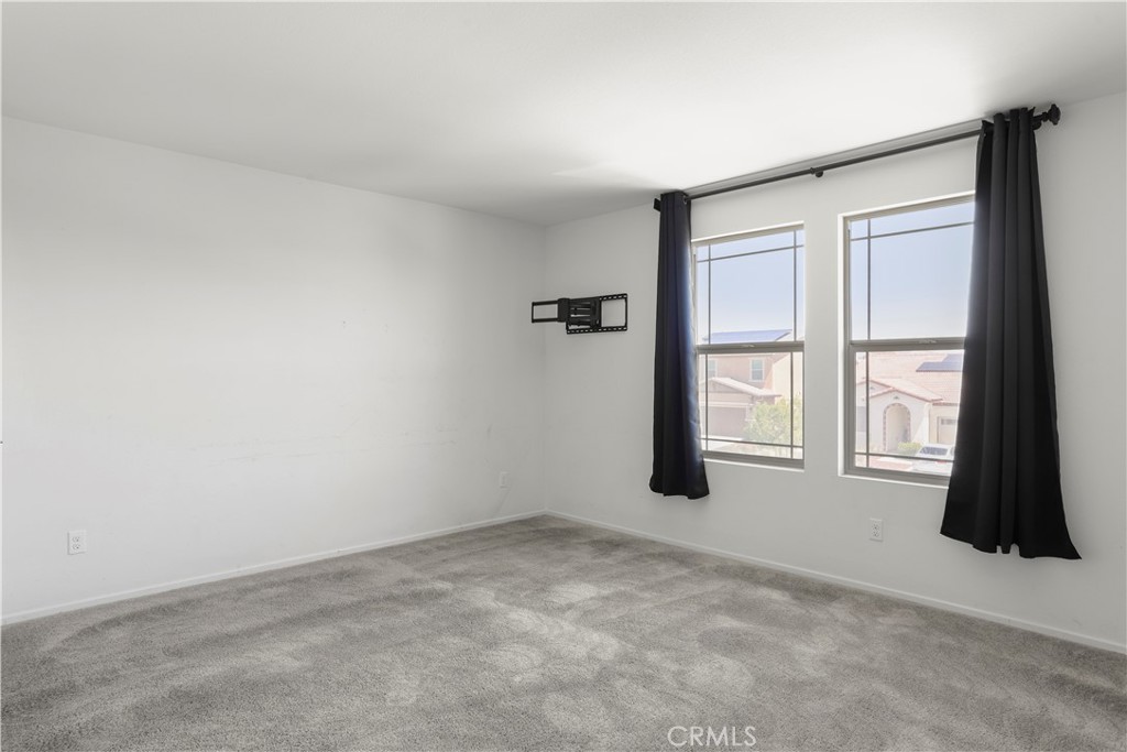 3320 Jack Rabbit Court Perris, CA 92570 - Photo 27 of 42 an empty room with windows