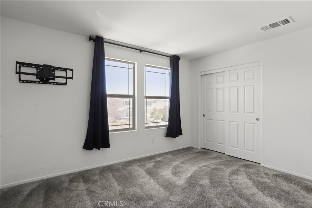 3320 Jack Rabbit Court Perris, CA 92570 - Photo 28 of 42 a view of an empty room with a window