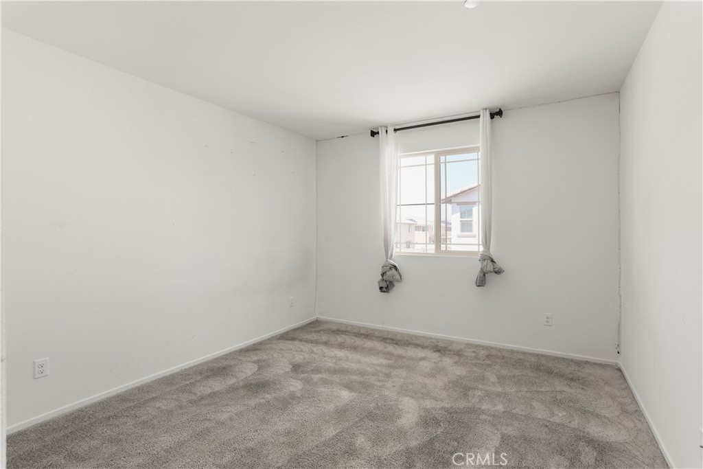 3320 Jack Rabbit Court Perris, CA 92570 - Photo 31 of 42 an empty room with windows