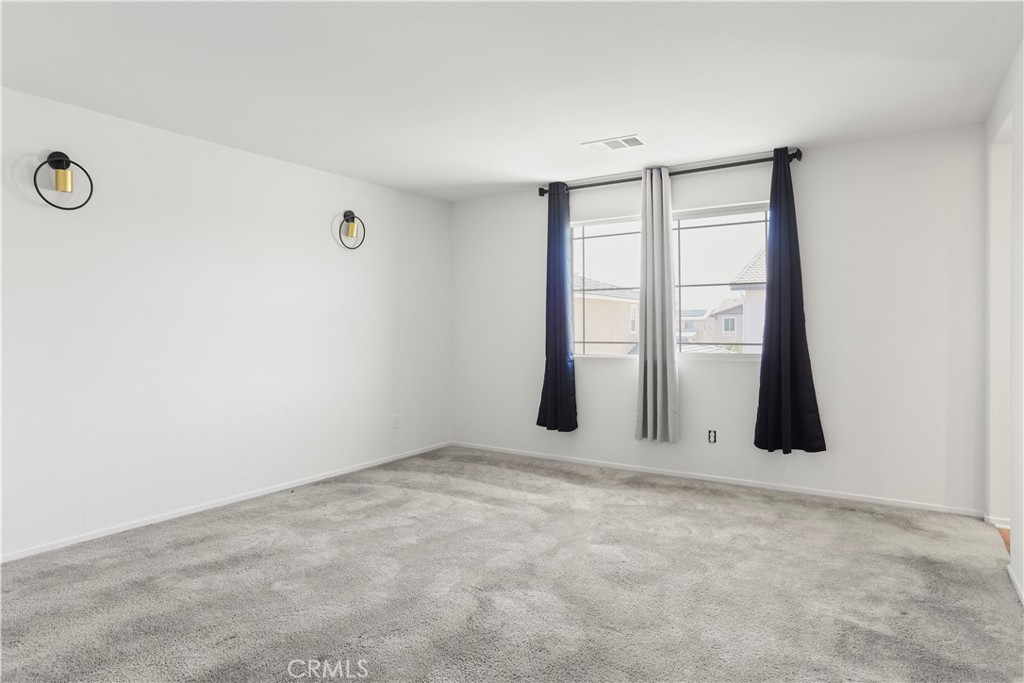 3320 Jack Rabbit Court Perris, CA 92570 - Photo 32 of 42 an empty room with windows