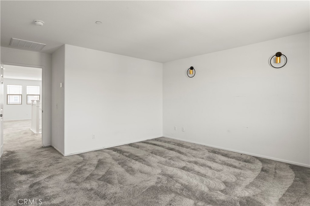 3320 Jack Rabbit Court Perris, CA 92570 - Photo 33 of 42 an empty room with windows
