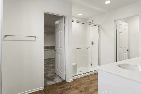 a bathroom with a sink a mirror and a bathtub