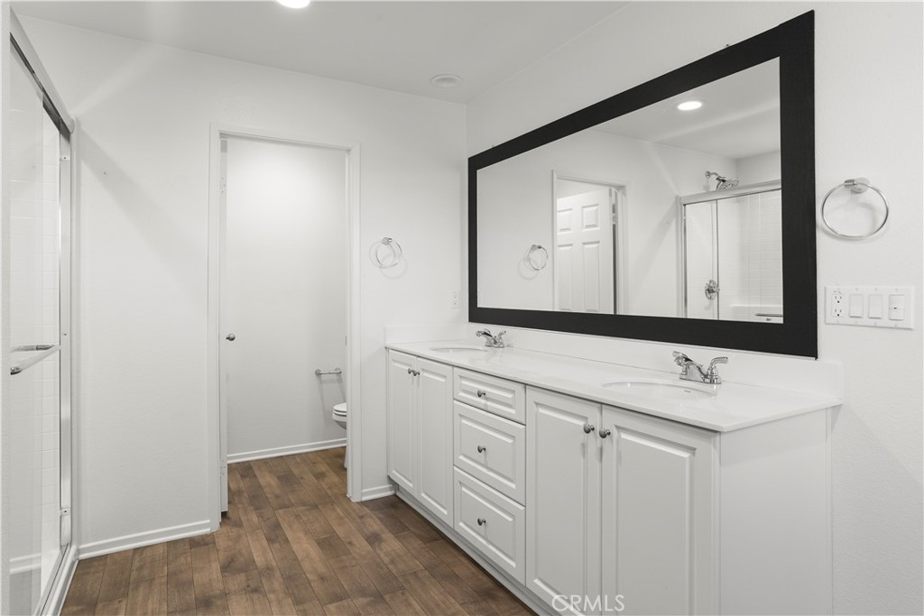 3320 Jack Rabbit Court Perris, CA 92570 - Photo 36 of 42 a bathroom with a sink and a mirror