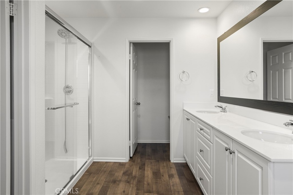 3320 Jack Rabbit Court Perris, CA 92570 - Photo 40 of 42 a bathroom with a double vanity sink and mirror