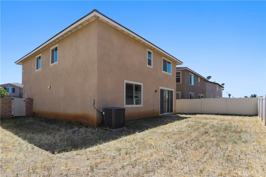 3320 Jack Rabbit Court Perris, CA 92570 - Photo 41 of 42 a view of a house with a backyard