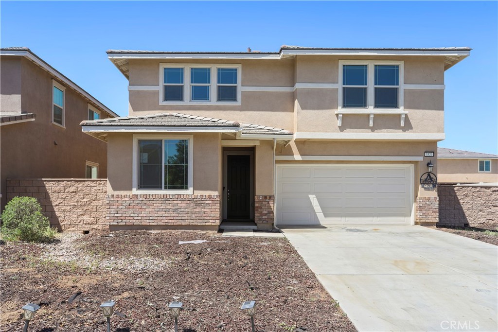 3320 Jack Rabbit Court Perris, CA 92570 - Photo 5 of 42 a front view of a house with a yard