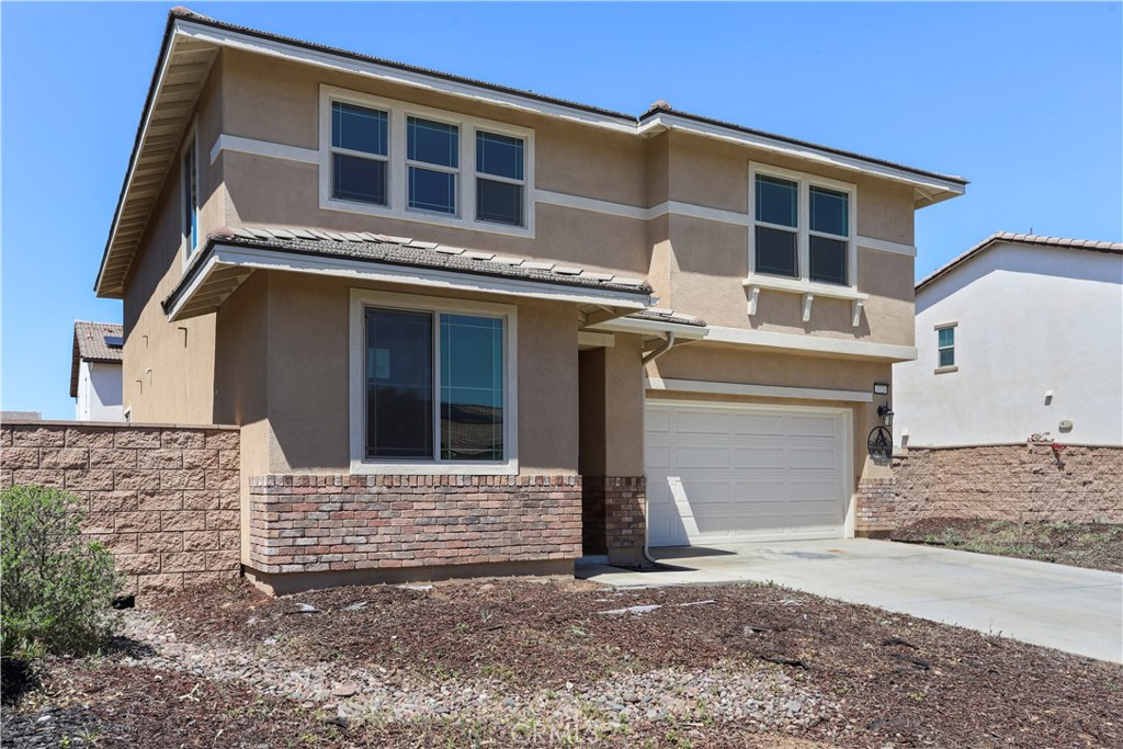 3320 Jack Rabbit Court Perris, CA 92570 - Photo 6 of 42 a front view of a house with a yard