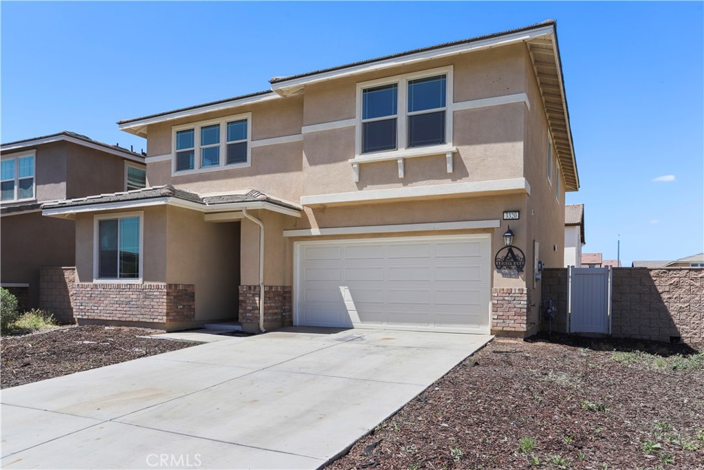 3320 Jack Rabbit Court Perris, CA 92570 - Photo 7 of 42 a front view of a house with a yard