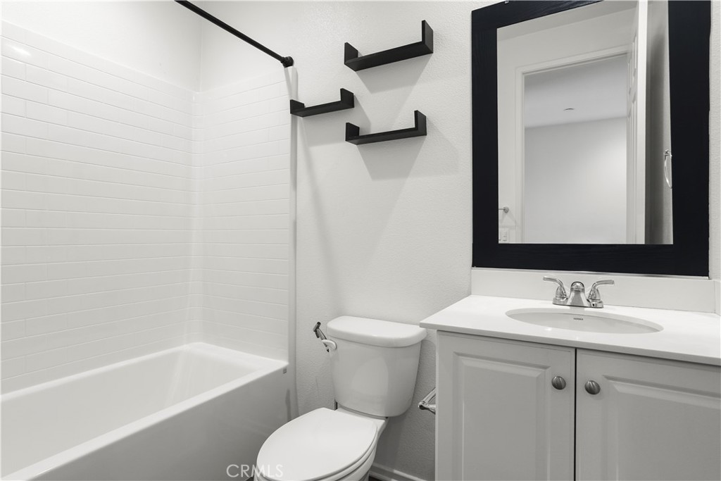3320 Jack Rabbit Court Perris, CA 92570 - Photo 10 of 42 a bathroom with a sink toilet and shower