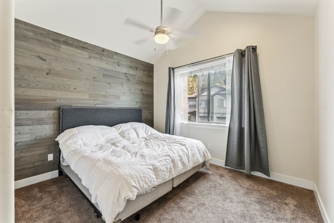77 Wayback Drive, Unit 77 Keystone, CO 80435 - Photo 14 of 35 a bed sitting in a bedroom next to a window
