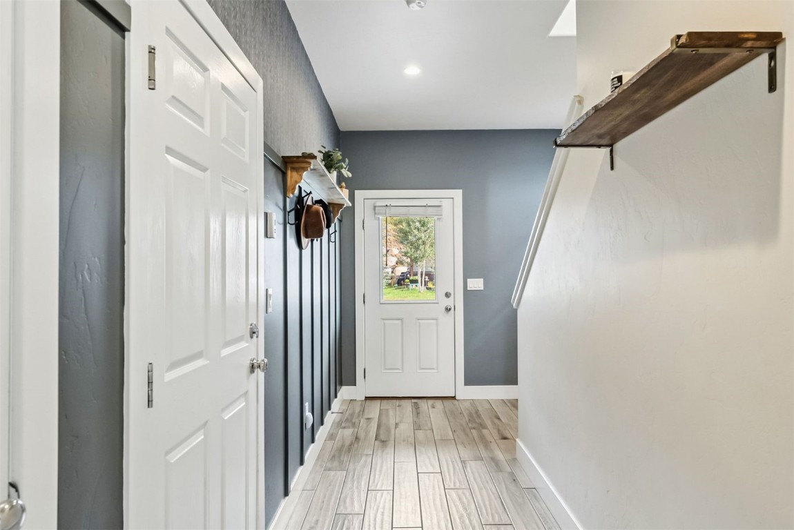 77 Wayback Drive, Unit 77 Keystone, CO 80435 - Photo 26 of 35 a view of a hallway with wooden floor and staircase