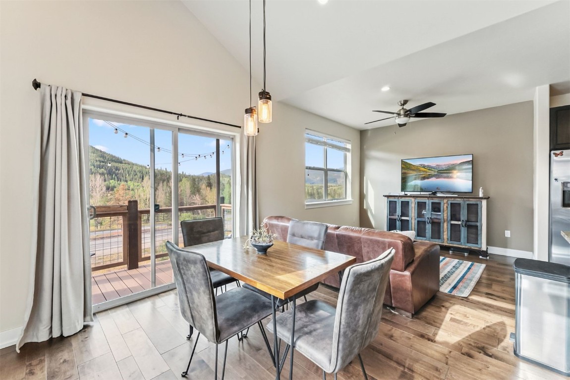 77 Wayback Drive, Unit 77 Keystone, CO 80435 - Photo 4 of 35 a view of a dining room with furniture window and wooden floor