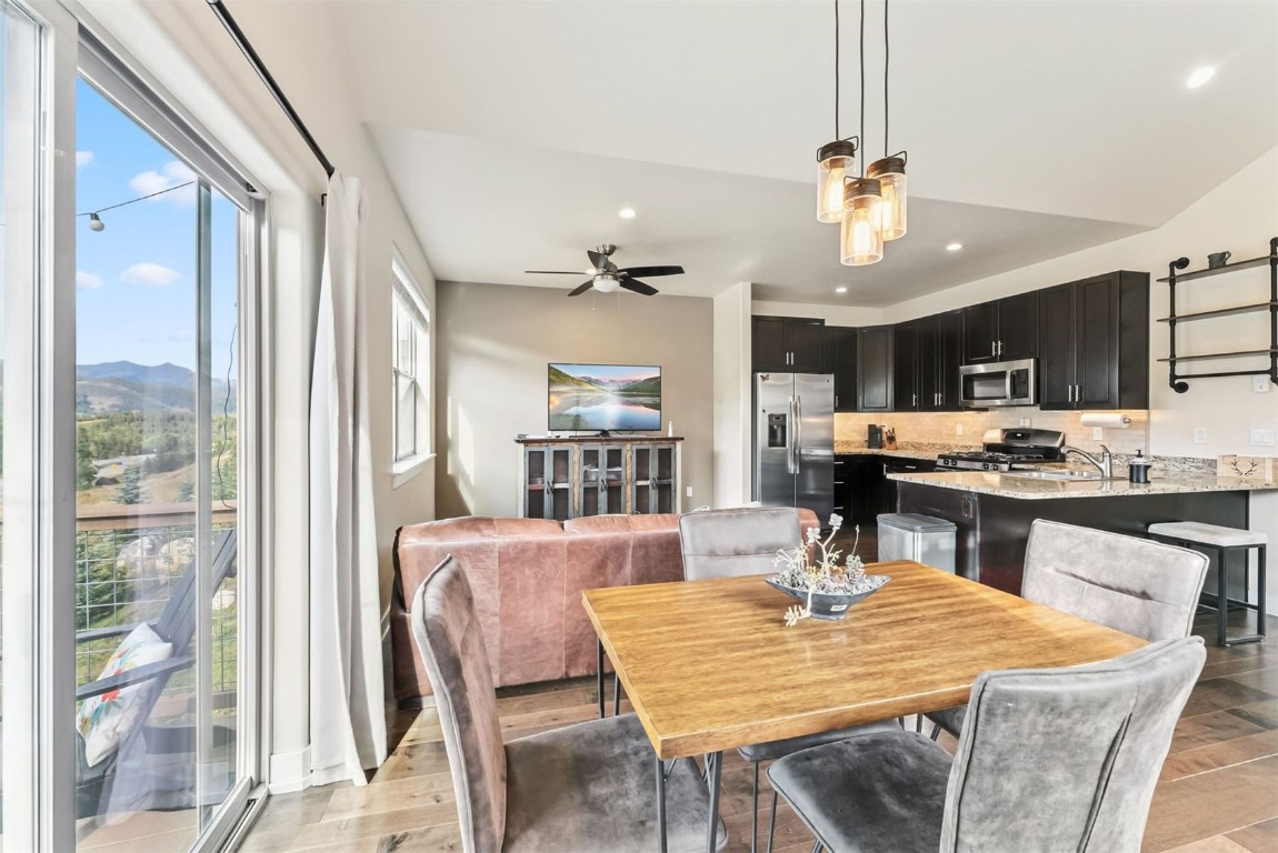77 Wayback Drive, Unit 77 Keystone, CO 80435 - Photo 5 of 35 a dining room with kitchen island granite countertop furniture and a kitchen view