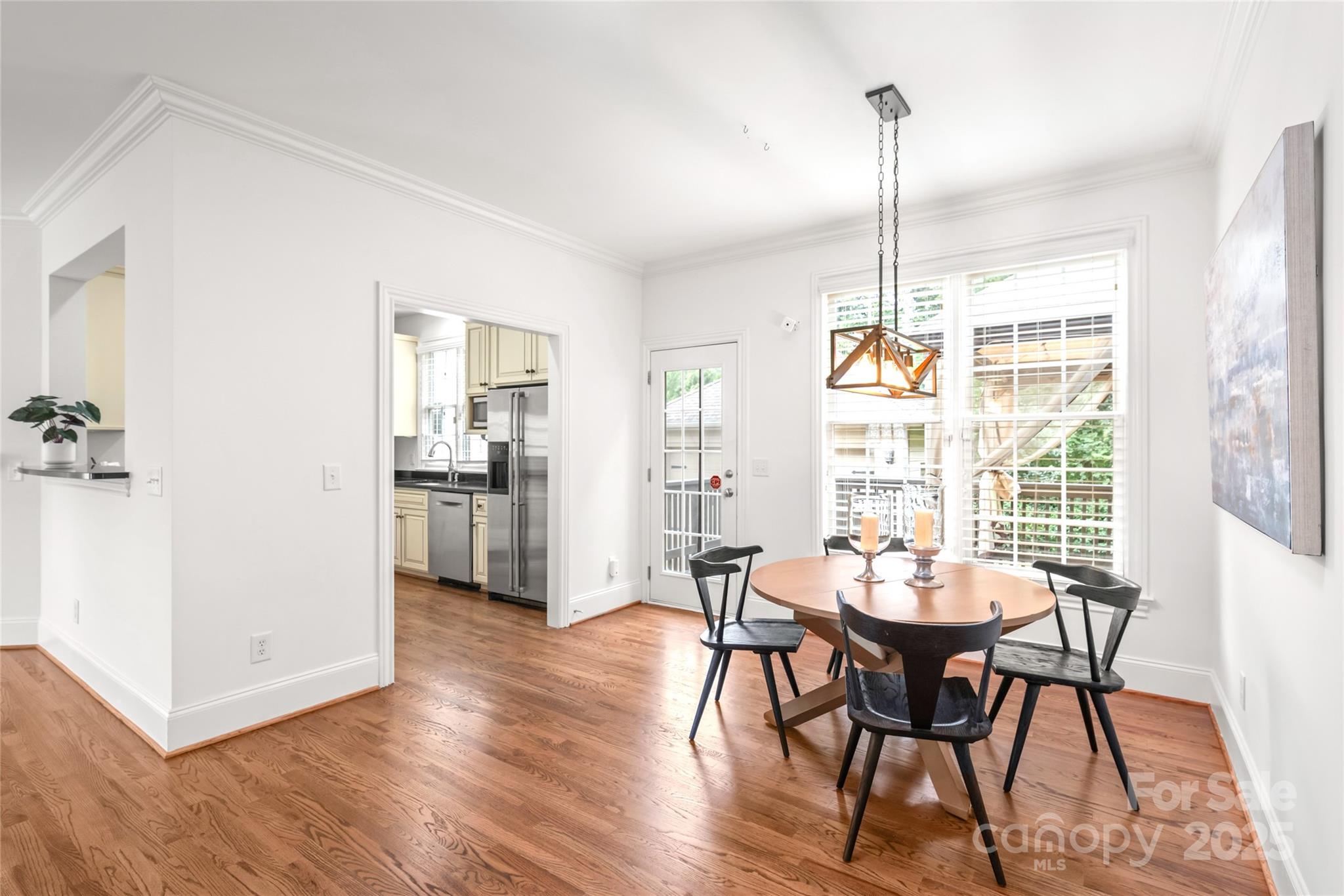915 Millbrook Road Charlotte, NC 28211 - Photo 11 of 39 a view of a dining room with furniture window and wooden floor