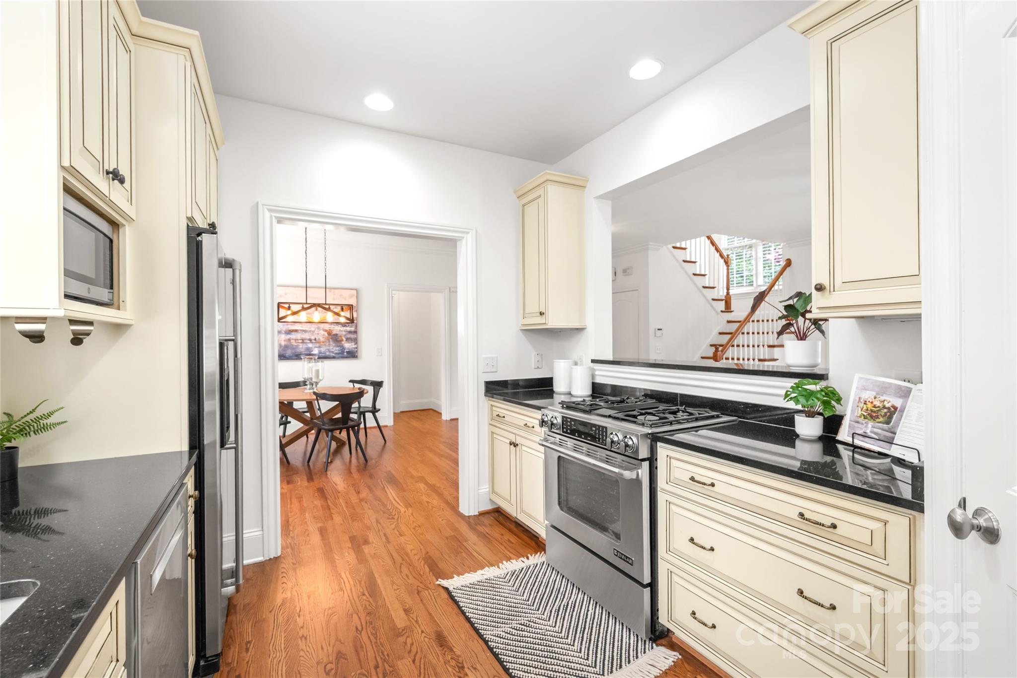 915 Millbrook Road Charlotte, NC 28211 - Photo 15 of 39 a kitchen with a stove a sink and a refrigerator