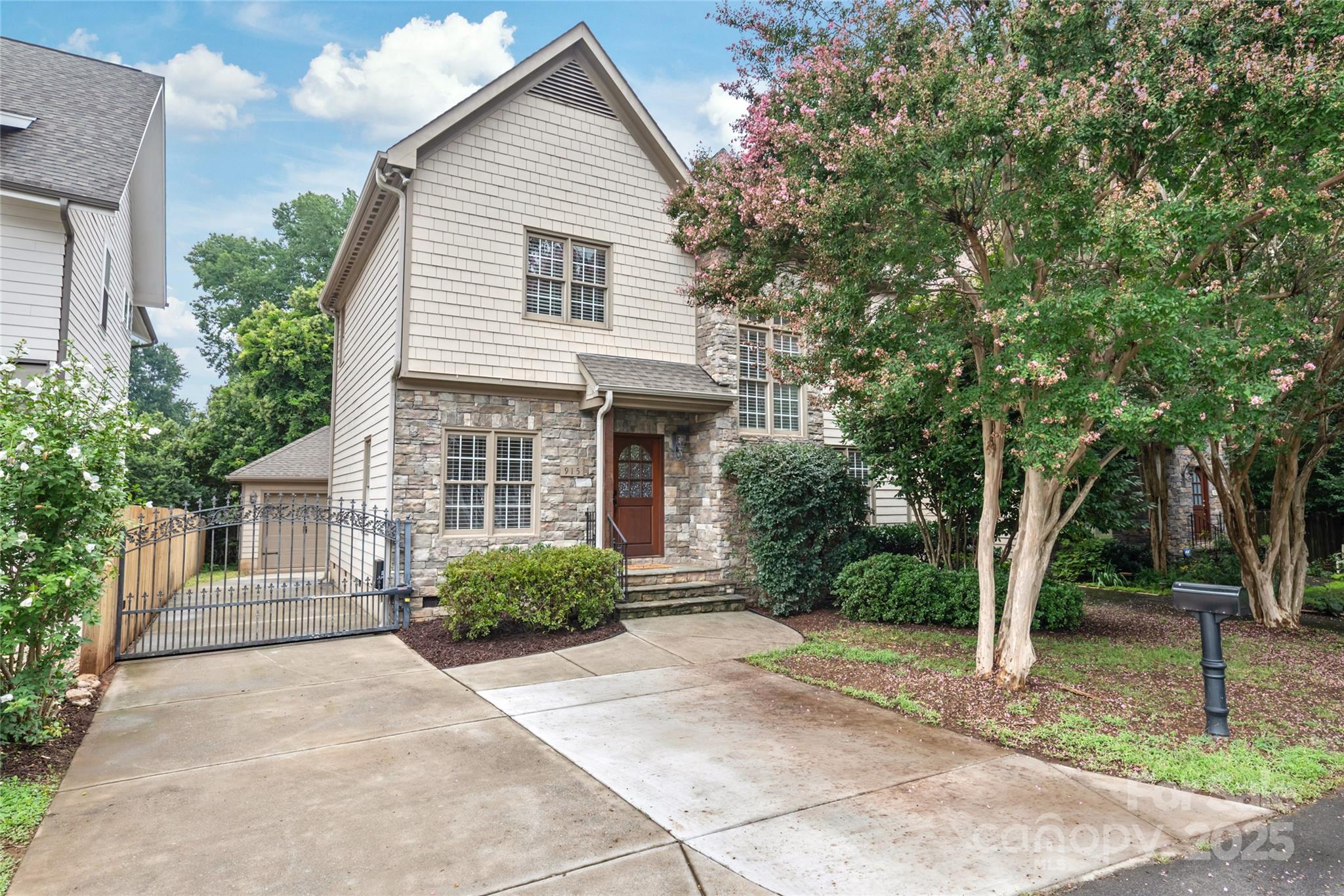 915 Millbrook Road Charlotte, NC 28211 - Photo 2 of 39 a front view of a house with garden