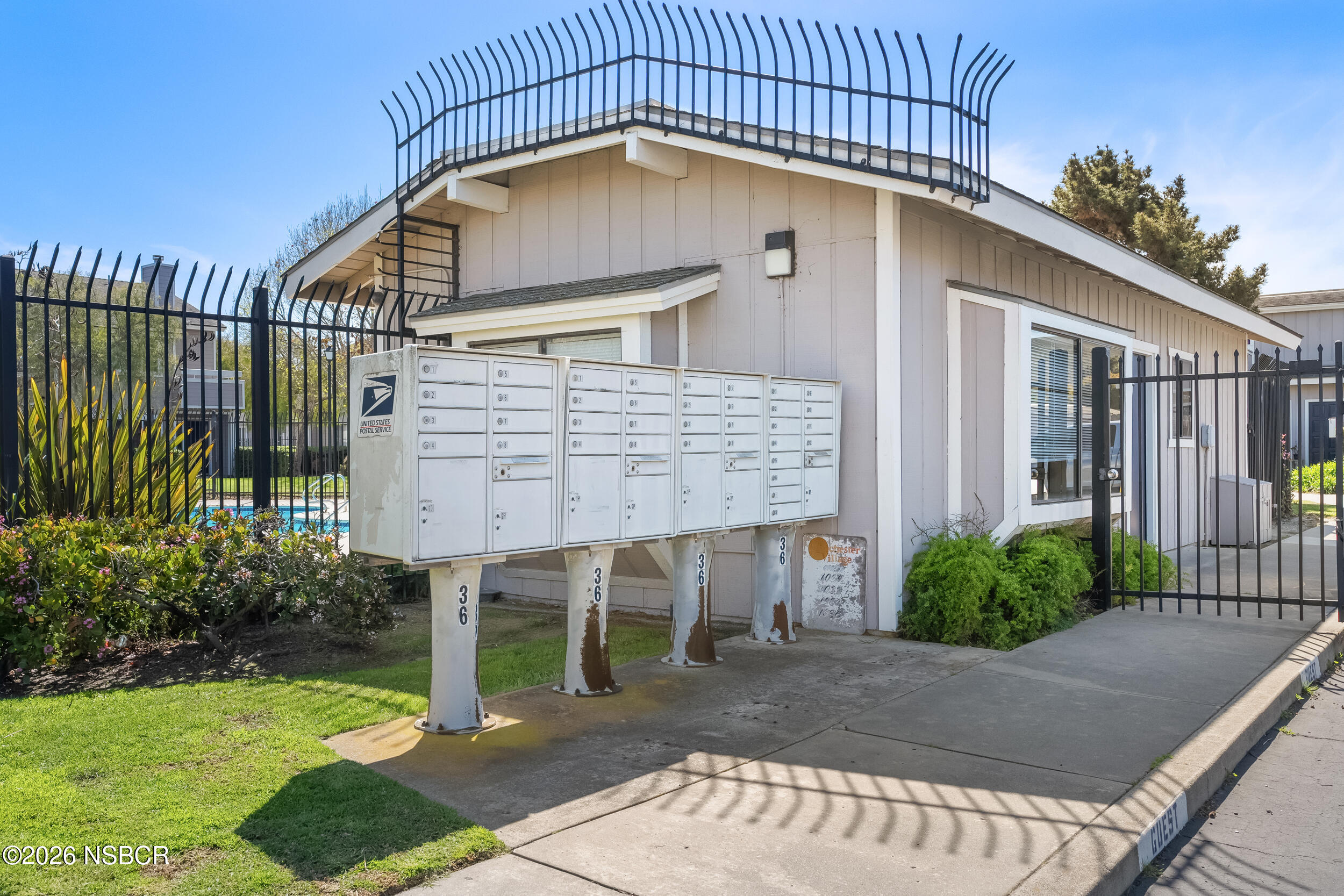 218 North R Street Lompoc, CA 93436 - Photo 23 of 24 a view of a brick house with a small yard and plants